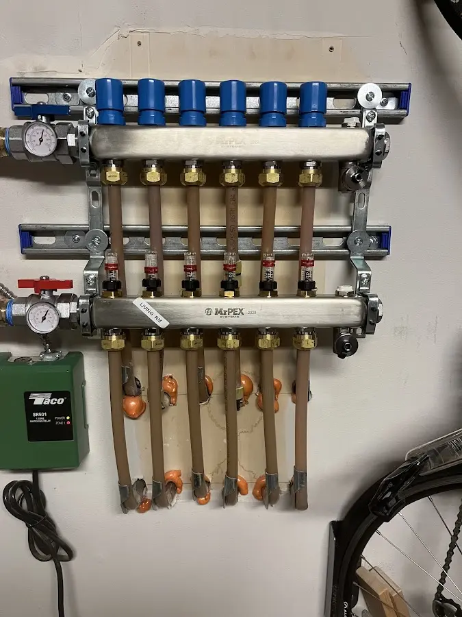 Plumber performing Water Heater Repair at a residential property in Baldwyn